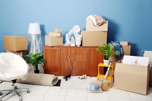 Organised moving boxes and packing materials prepared for a Hounslow move