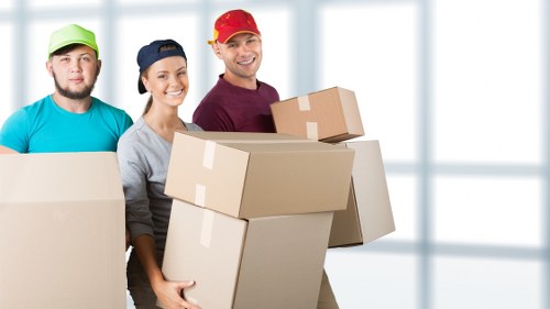 Team members preparing moving equipment safely before a removal job