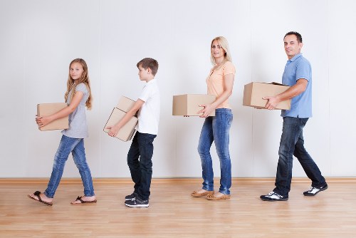 Local moving team handling boxes and household items in Hounslow