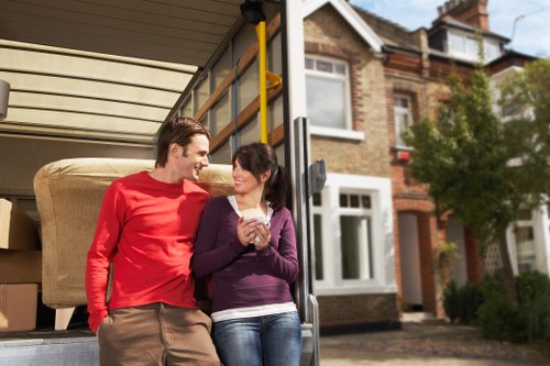 House removal team handling furniture in Hounslow